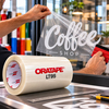 Rouleau de tape d'application transparent ORATAPE LT95 et marouflage à la raclette sur vitrine